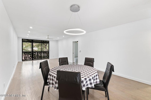 dining area featuring baseboards, recessed lighting, and light wood-style flooring