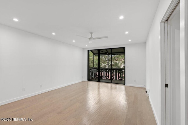 spare room featuring recessed lighting, light wood-style flooring, ceiling fan, and baseboards