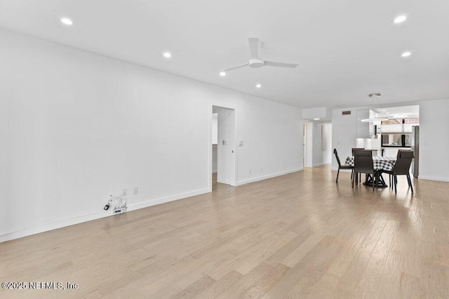dining space with baseboards, recessed lighting, a ceiling fan, and light wood-style flooring