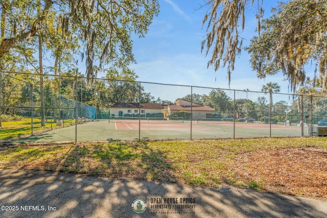 view of sport court with fence
