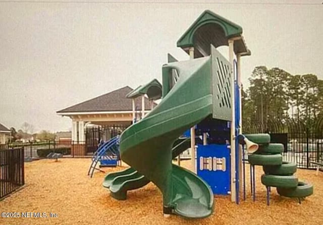 communal playground featuring fence