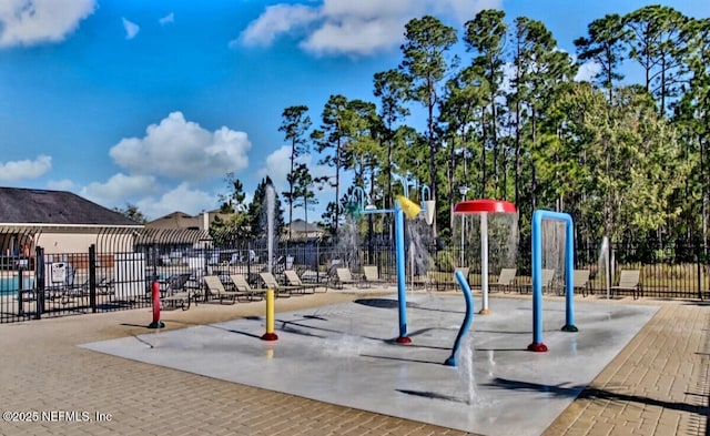 view of home's community with fence