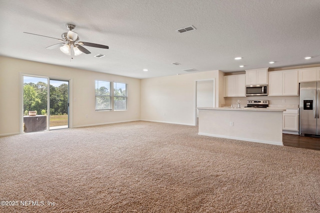 4402 Warm Springs Way, Middleburg, FL 32068 - unfurnished living room with carpet flooring, a ceiling fan, recessed lighting, baseboards, and a textured ceiling