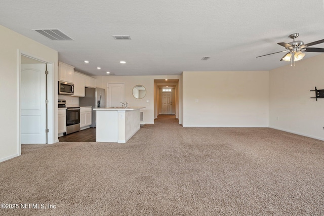 4402 Warm Springs Way, Middleburg, FL 32068 - unfurnished living room featuring dark carpet, baseboards, a ceiling fan, a sink, and recessed lighting