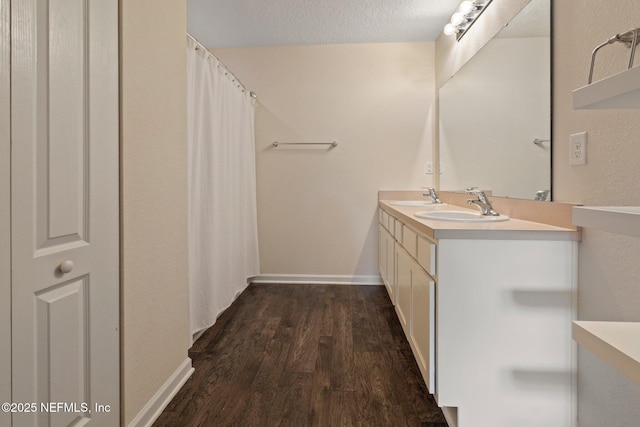 4402 Warm Springs Way, Middleburg, FL 32068 - full bath with wood finished floors, double vanity, and baseboards