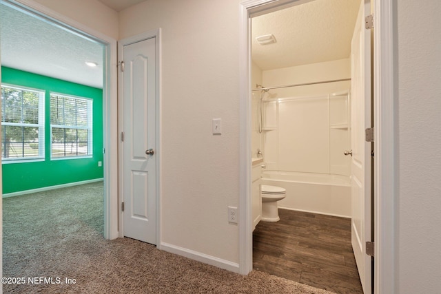 4402 Warm Springs Way, Middleburg, FL 32068 - full bathroom featuring toilet, bathtub / shower combination, a textured ceiling, and baseboards