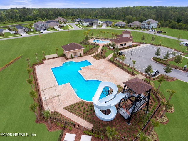 4402 Warm Springs Way, Middleburg, FL 32068 - community pool with a water slide, a patio, fence, and a residential view