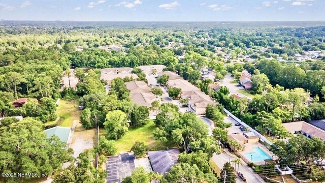 9421 Osprey Branch Trl Unit 4, Jacksonville, FL 32257 - birds eye view of property featuring a wooded view