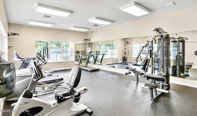 9421 Osprey Branch Trl Unit 4, Jacksonville, FL 32257 - workout area with a textured ceiling, visible vents, and baseboards