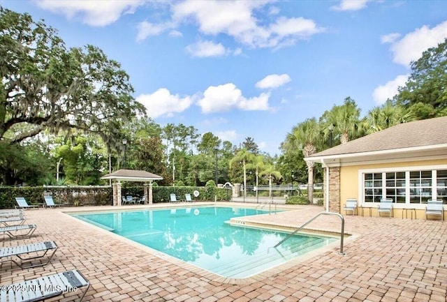 9421 Osprey Branch Trl Unit 4, Jacksonville, FL 32257 - community pool featuring a patio and fence