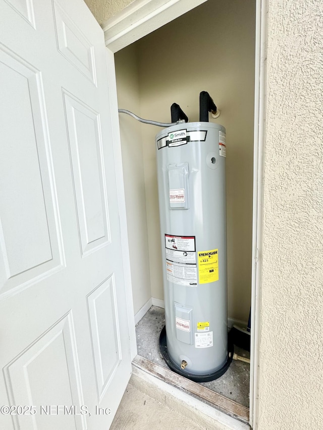 9421 Osprey Branch Trl Unit 4, Jacksonville, FL 32257 - utility room with electric water heater