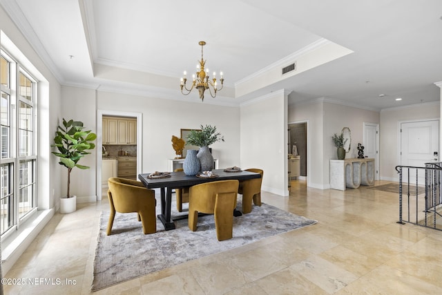 office space with ornamental molding, visible vents, plenty of natural light, and an inviting chandelier