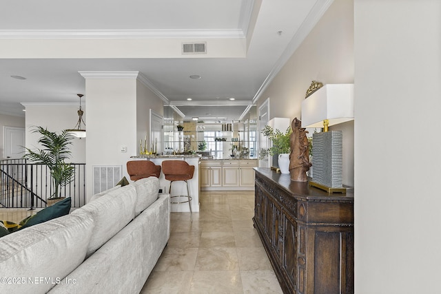 interior space with visible vents and crown molding