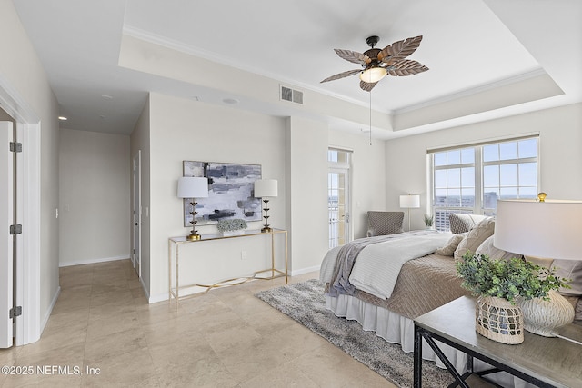bedroom with visible vents, ornamental molding, a raised ceiling, and a ceiling fan