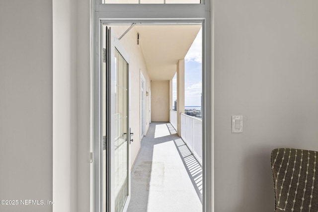 corridor with carpet flooring