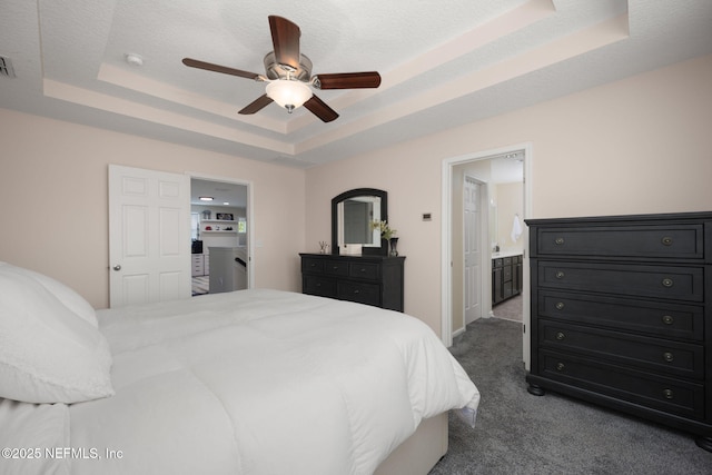 72 Whistler Trce, Ponte Vedra, FL 32081 - bedroom with carpet floors, baseboards, a tray ceiling, a ceiling fan, and ensuite bath