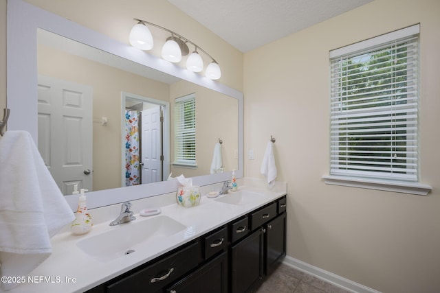 72 Whistler Trce, Ponte Vedra, FL 32081 - bathroom featuring double vanity, baseboards, a sink, and tile patterned flooring