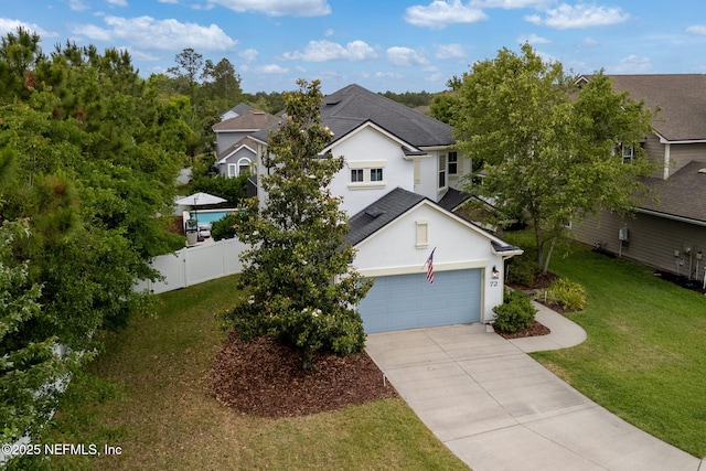 72 Whistler Trce, Ponte Vedra, FL 32081 - view of front of house featuring driveway, a garage, fence, a front lawn, and stucco siding
