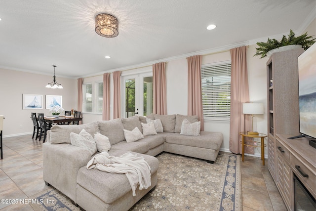 72 Whistler Trce, Ponte Vedra, FL 32081 - living room with crown molding, baseboards, a notable chandelier, and plenty of natural light