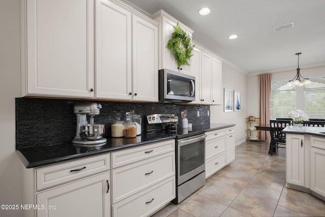 72 Whistler Trce, Ponte Vedra, FL 32081 - kitchen with dark countertops, appliances with stainless steel finishes, decorative backsplash, visible vents, and ornamental molding