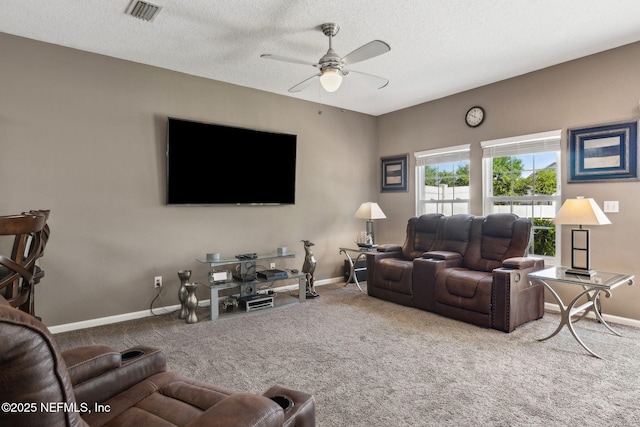 living area featuring carpet flooring, a ceiling fan, visible vents, and baseboards