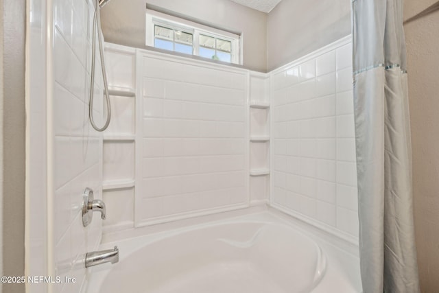 bathroom with shower / bath combo
