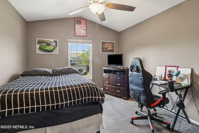 carpeted bedroom featuring ceiling fan and vaulted ceiling