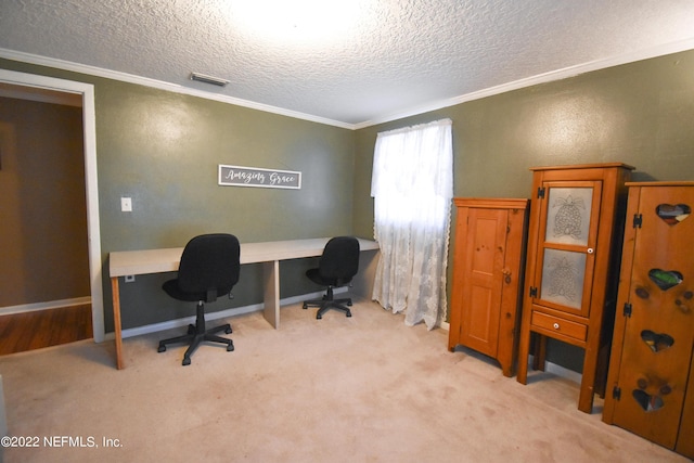 office area featuring a textured ceiling, visible vents, ornamental molding, and carpet flooring