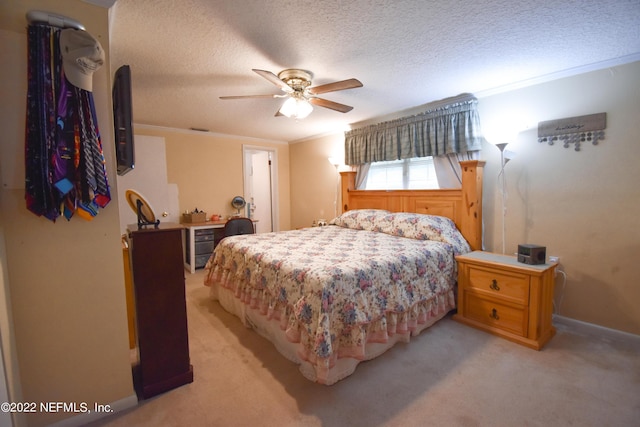 bedroom featuring baseboards, a ceiling fan, a textured ceiling, and light colored carpet