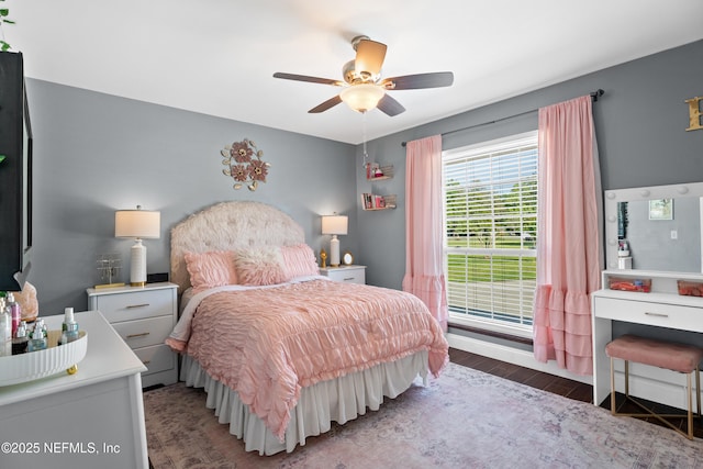 bedroom featuring wood finished floors and a ceiling fan