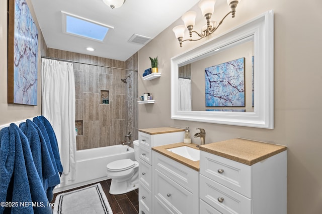 bathroom featuring shower / bath combo, visible vents, toilet, wood finished floors, and vanity