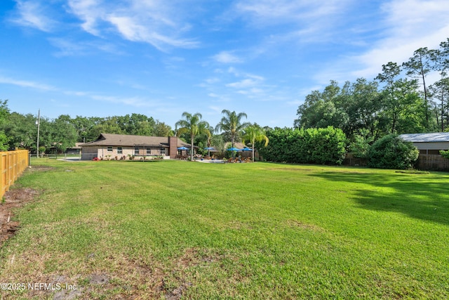 view of yard with fence