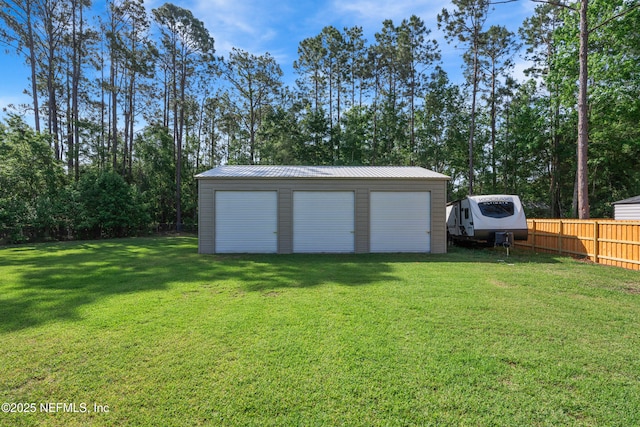 view of outbuilding featuring fence and an outdoor structure