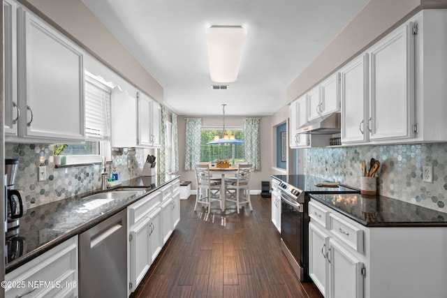 kitchen featuring stainless steel appliances, white cabinets, and under cabinet range hood
