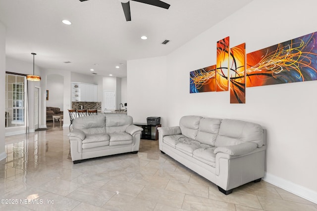 living room with visible vents, a ceiling fan, recessed lighting, and baseboards