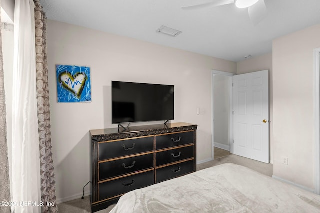 carpeted bedroom featuring visible vents, ceiling fan, and baseboards