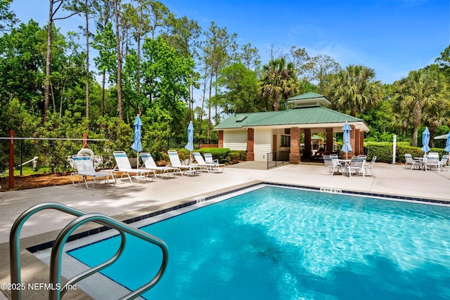 community pool featuring a patio, fence, and a gazebo