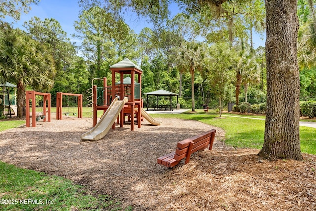 community jungle gym featuring a lawn