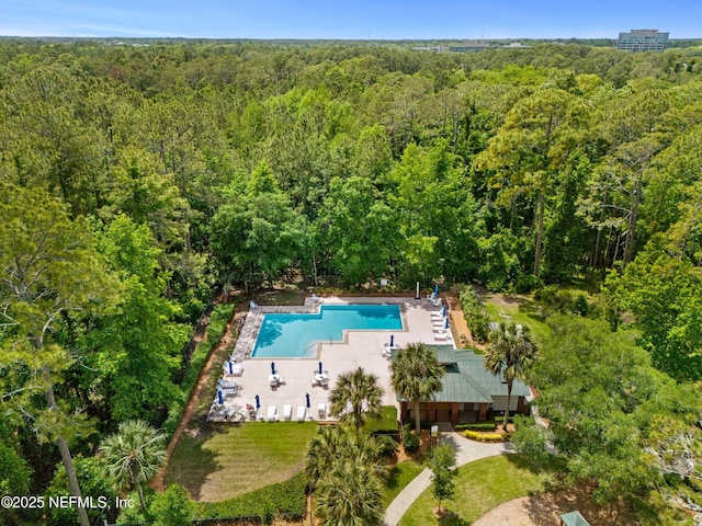 birds eye view of property with a wooded view