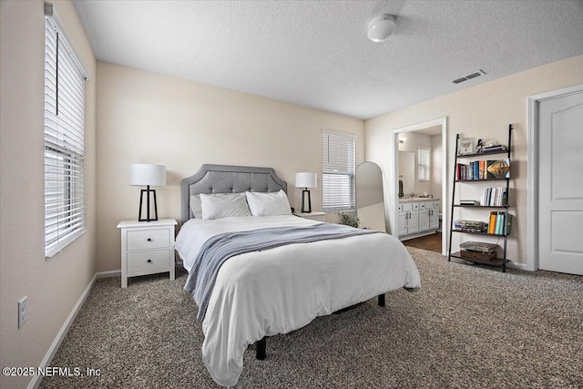 2294 Falling Star Ln, Green Cove Springs, FL 32043 - carpeted bedroom featuring multiple windows, a textured ceiling, and connected bathroom