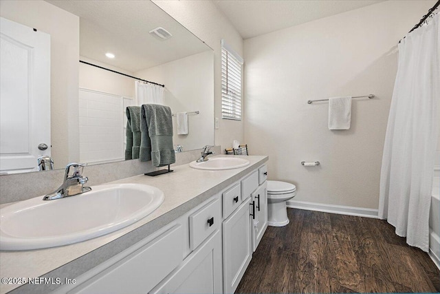 2294 Falling Star Ln, Green Cove Springs, FL 32043 - full bathroom with double vanity, wood finished floors, and shower / tub combo