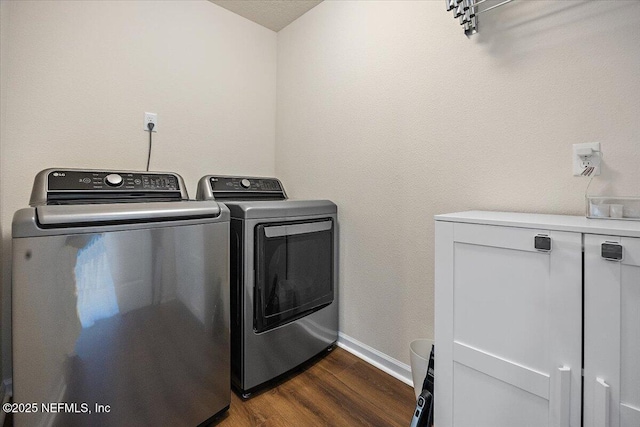 2294 Falling Star Ln, Green Cove Springs, FL 32043 - laundry area with independent washer and dryer and dark wood-style flooring