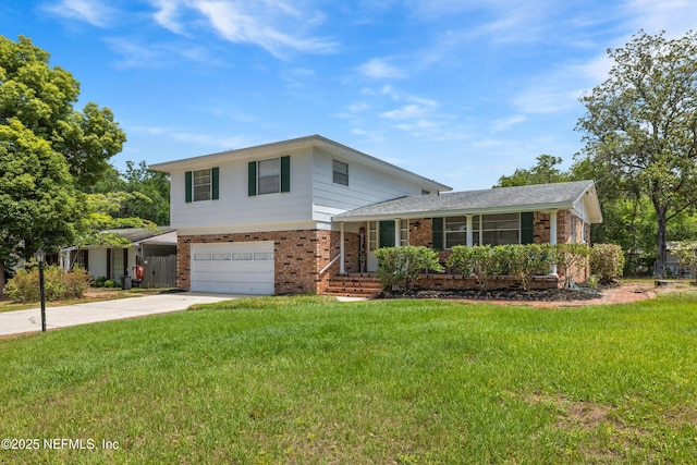 split level home with a garage, concrete driveway, a front lawn, and brick siding