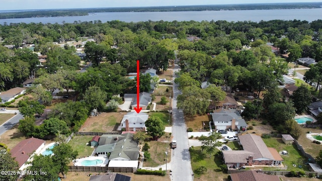 birds eye view of property featuring a residential view and a water view