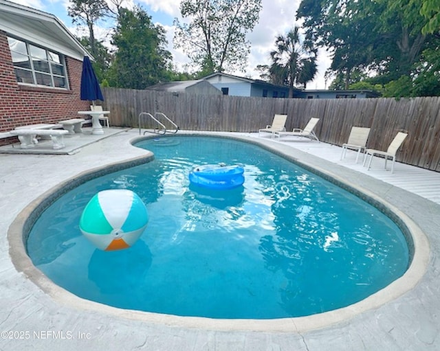 1118 Brookmont Ave E, Jacksonville, FL 32211 - view of swimming pool with a fenced backyard and a patio