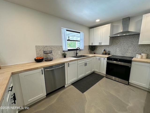 1118 Brookmont Ave E, Jacksonville, FL 32211 - kitchen with wall chimney exhaust hood, black electric range, dishwasher, butcher block countertops, and tasteful backsplash