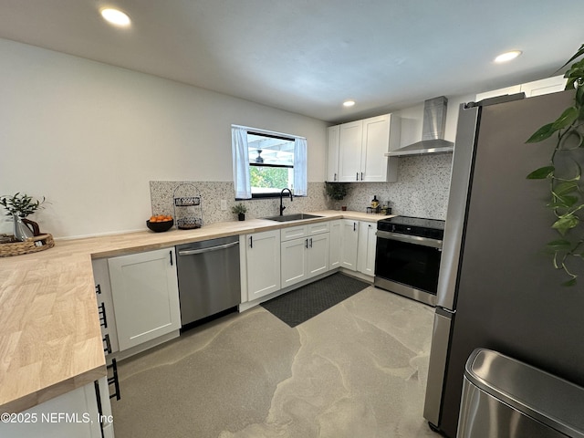 1118 Brookmont Ave E, Jacksonville, FL 32211 - kitchen featuring wall chimney range hood, appliances with stainless steel finishes, decorative backsplash, white cabinets, and recessed lighting