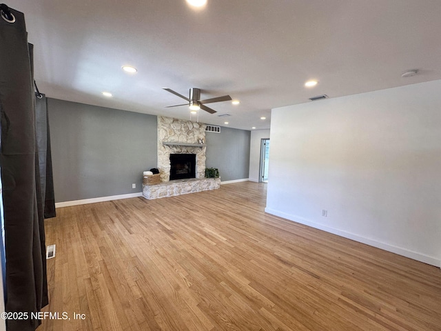 1118 Brookmont Ave E, Jacksonville, FL 32211 - unfurnished living room with a ceiling fan, light wood-style flooring, a fireplace, and recessed lighting