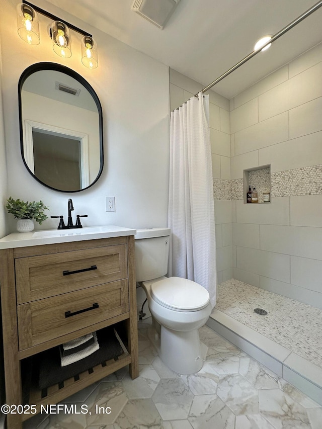 1118 Brookmont Ave E, Jacksonville, FL 32211 - full bath with marble look tile flooring, vanity, and a tile shower