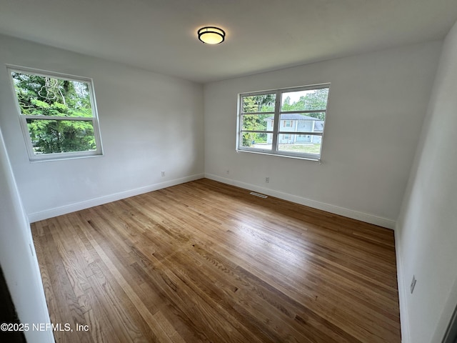 1118 Brookmont Ave E, Jacksonville, FL 32211 - unfurnished room with wood finished floors and baseboards